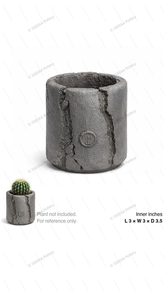 Storm gray cylindrical pot with cracked textured surface and weathered finish
