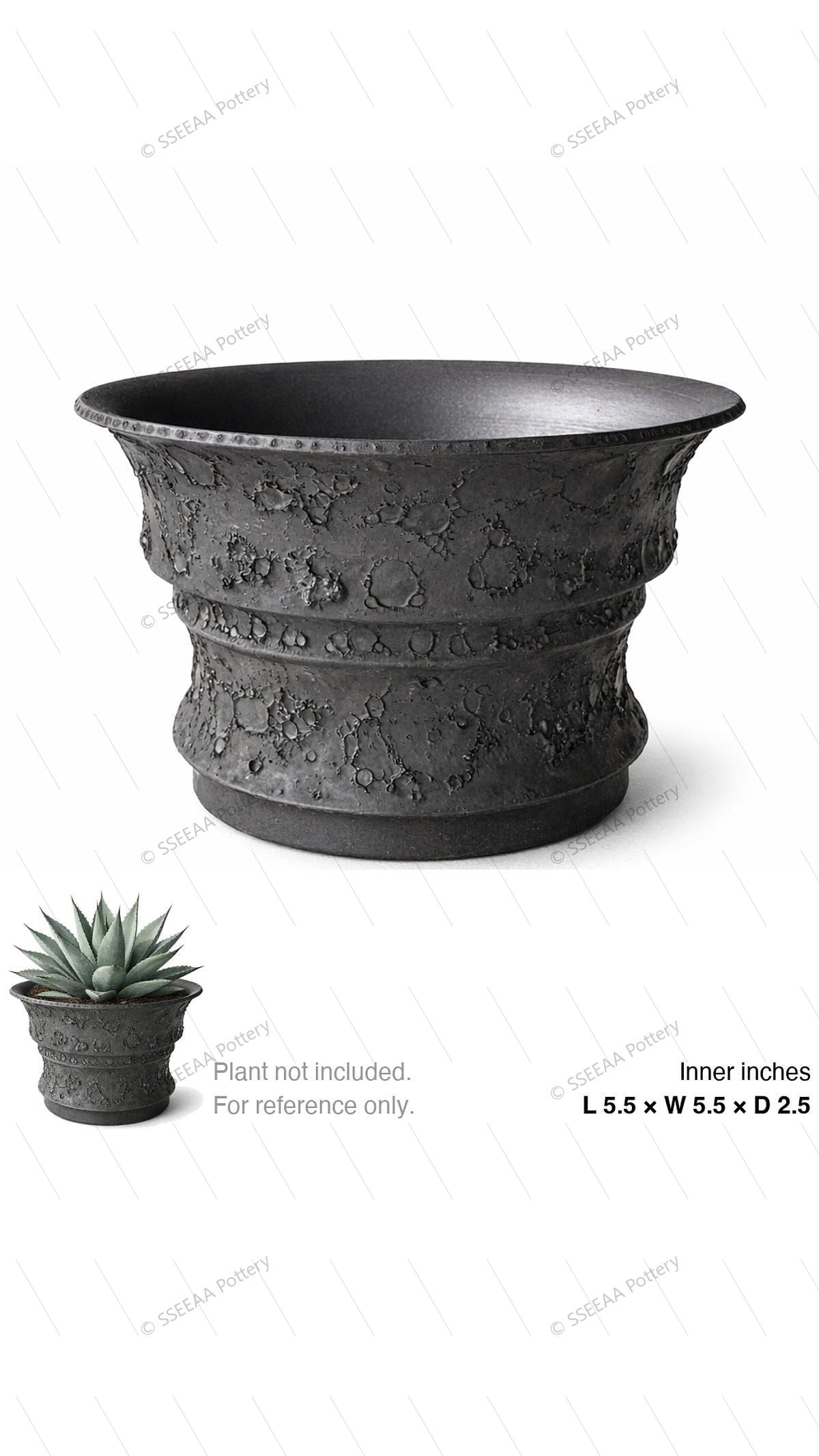 Charcoal textured footed pot with wide flared rim and craggy surface