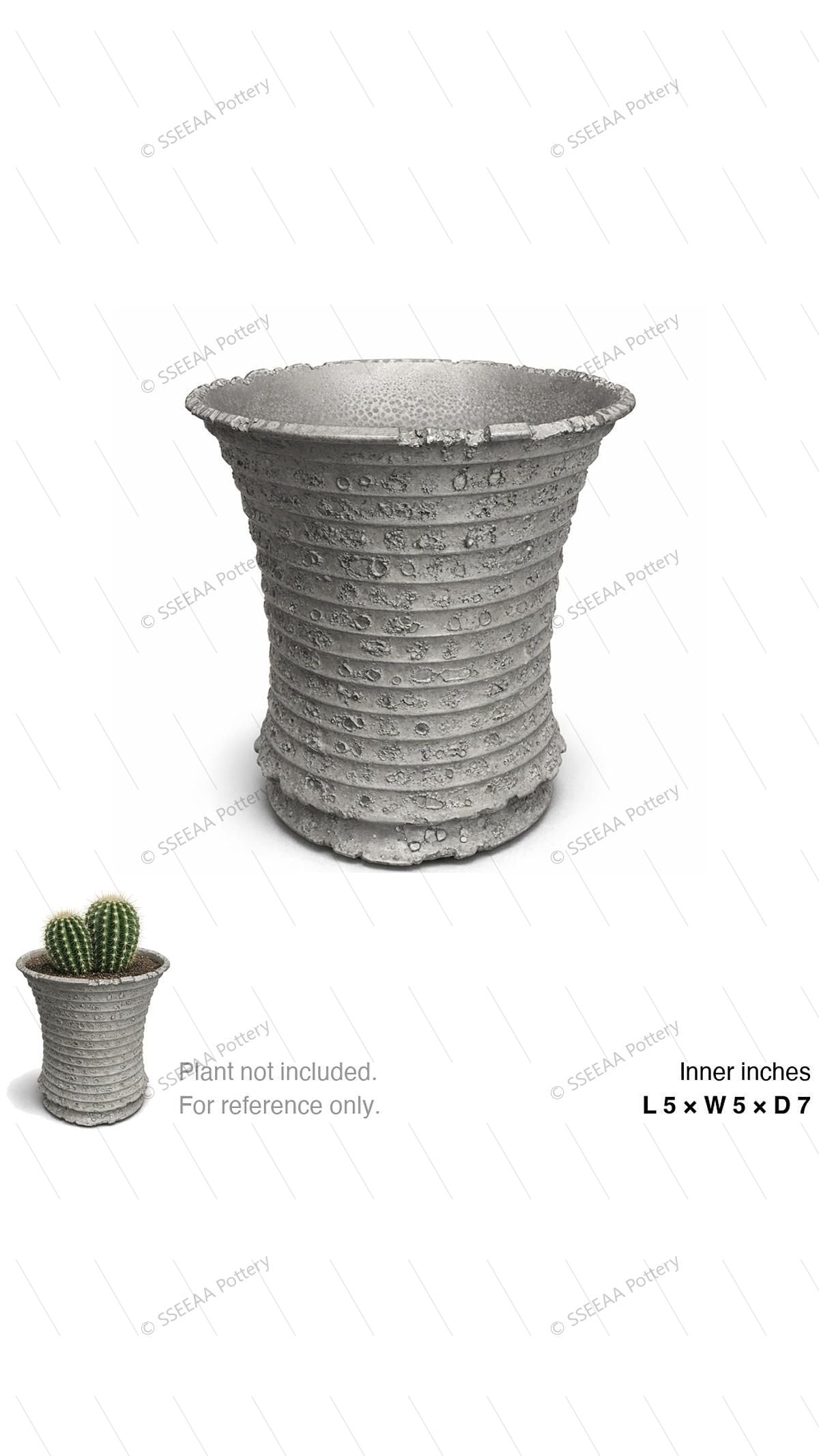 Textured gray fluted pot with a wide rim and tapered profile