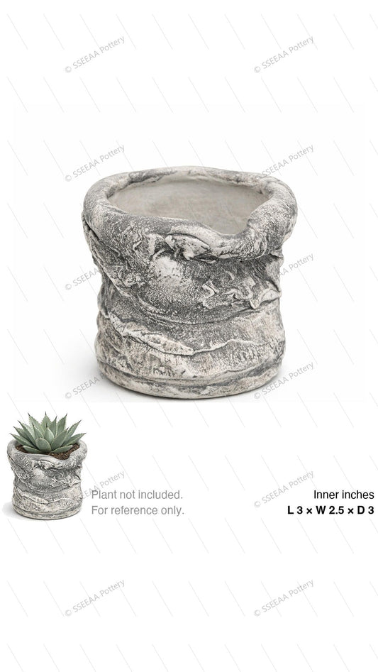 Weathered gray sculptural pot with wrapped organic rim and distressed finish.