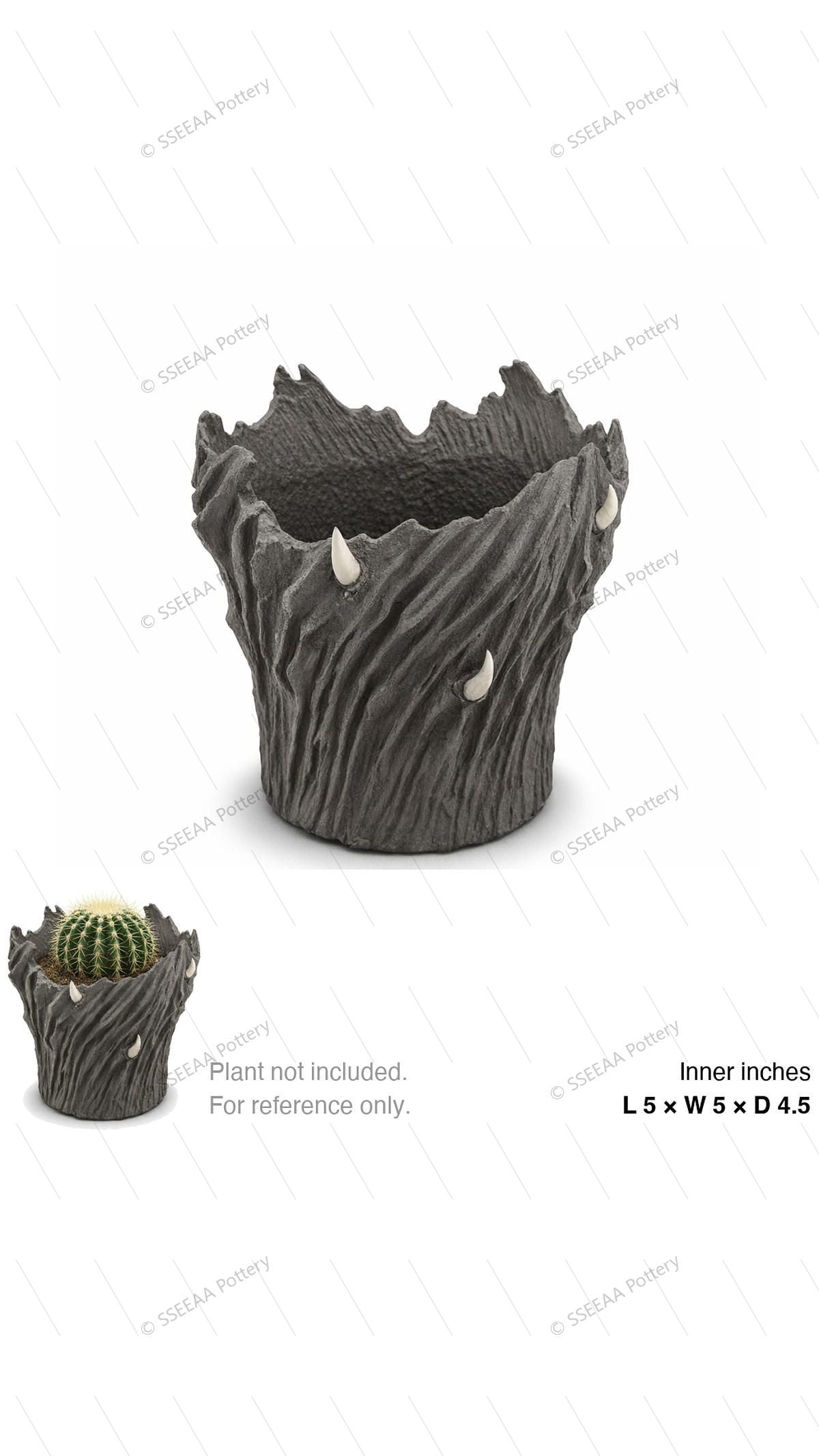 Charcoal sculptural pot with jagged rim and horn-like accents.