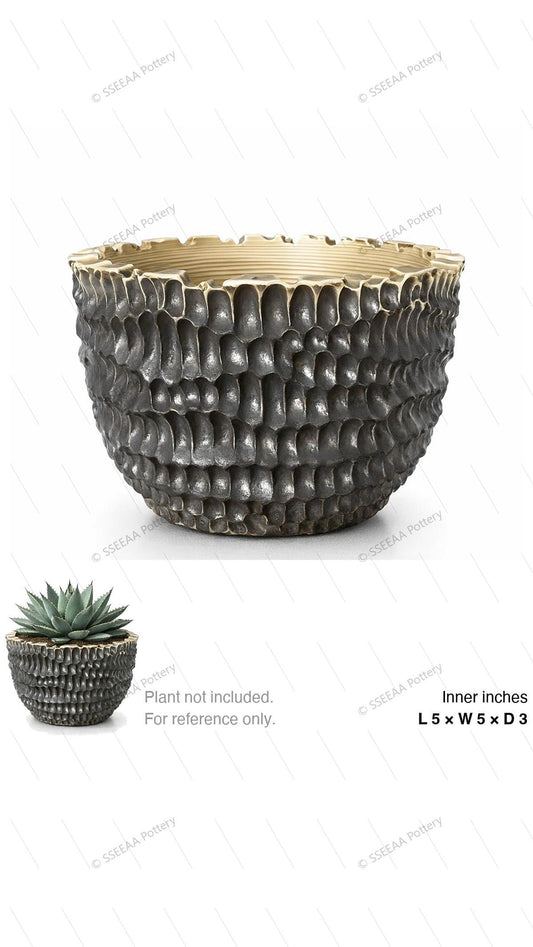 Textured charcoal ceramic pot with a cream rim and rounded profile.