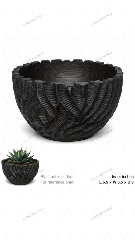 Black carved round pot with wide opening and textured leaf-like surface