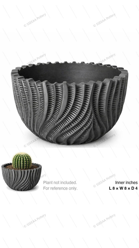 Charcoal textured rounded pot with swirling ridges and scalloped rim shown on a white background.