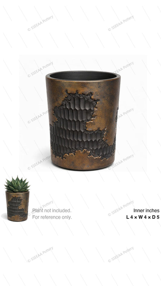 Weathered bronze and black textured cylindrical pot with a deep straight rim.