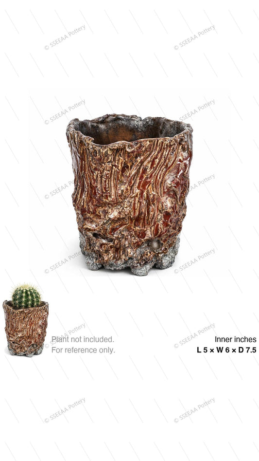 Textured rustic footed pot with bark-like finish and irregular rim