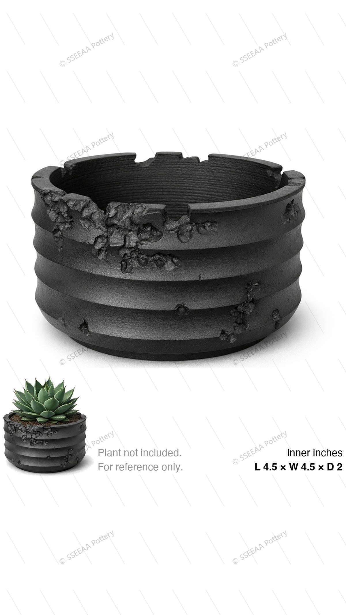 Black ribbed round pot with weathered cratered texture and wide opening