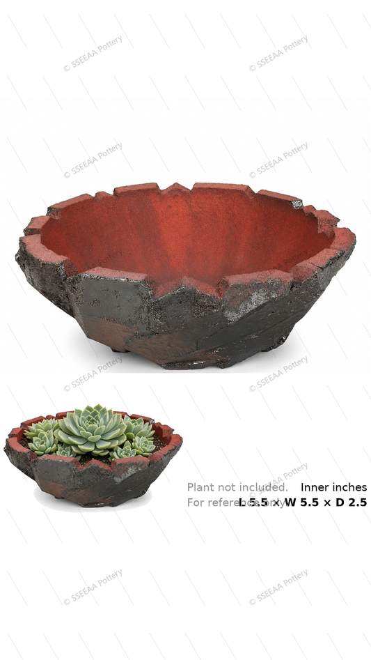 Craggy shallow rust-red pot with dark weathered exterior and jagged rim